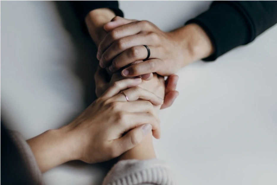 4 hands holding each other