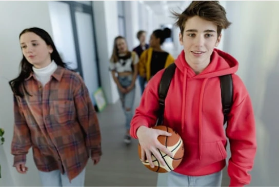 people walking in a hallway