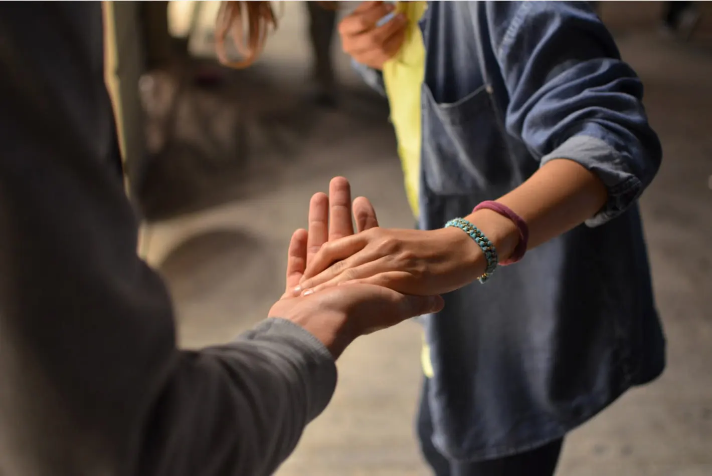 2 people holding hands