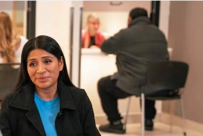 people sitting in a room talking by partners