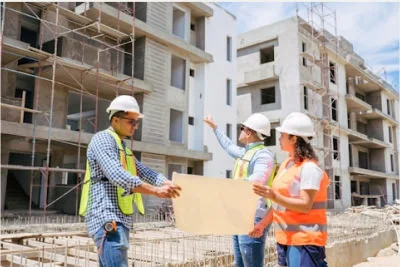 construction people discussing in front of a site